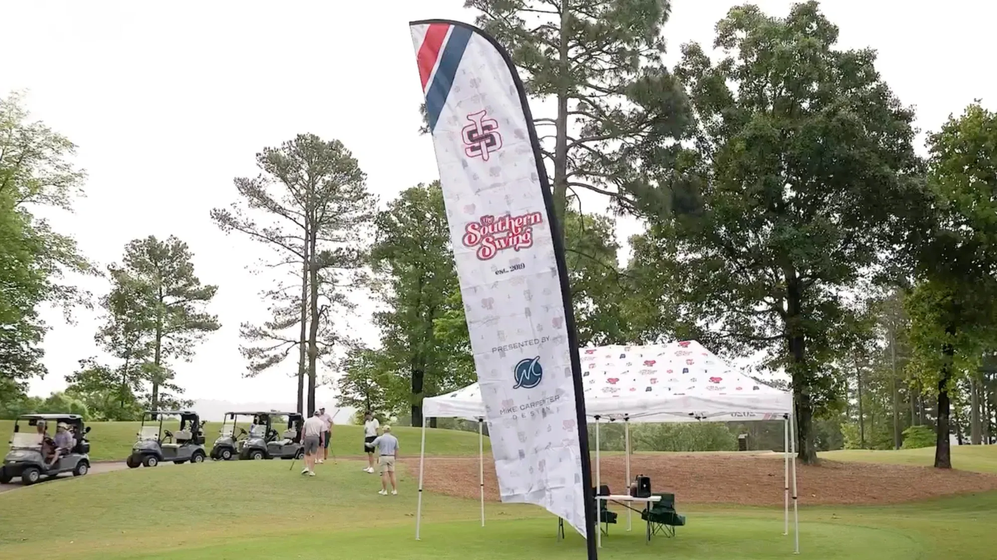 The Southern Swing — Feather flag and canopy — first tee